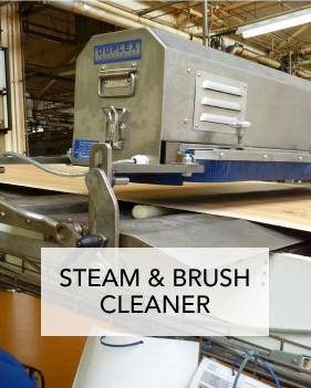 A steam and brush cleaner being used to clean a food conveyor belt for optimal hygiene and performance